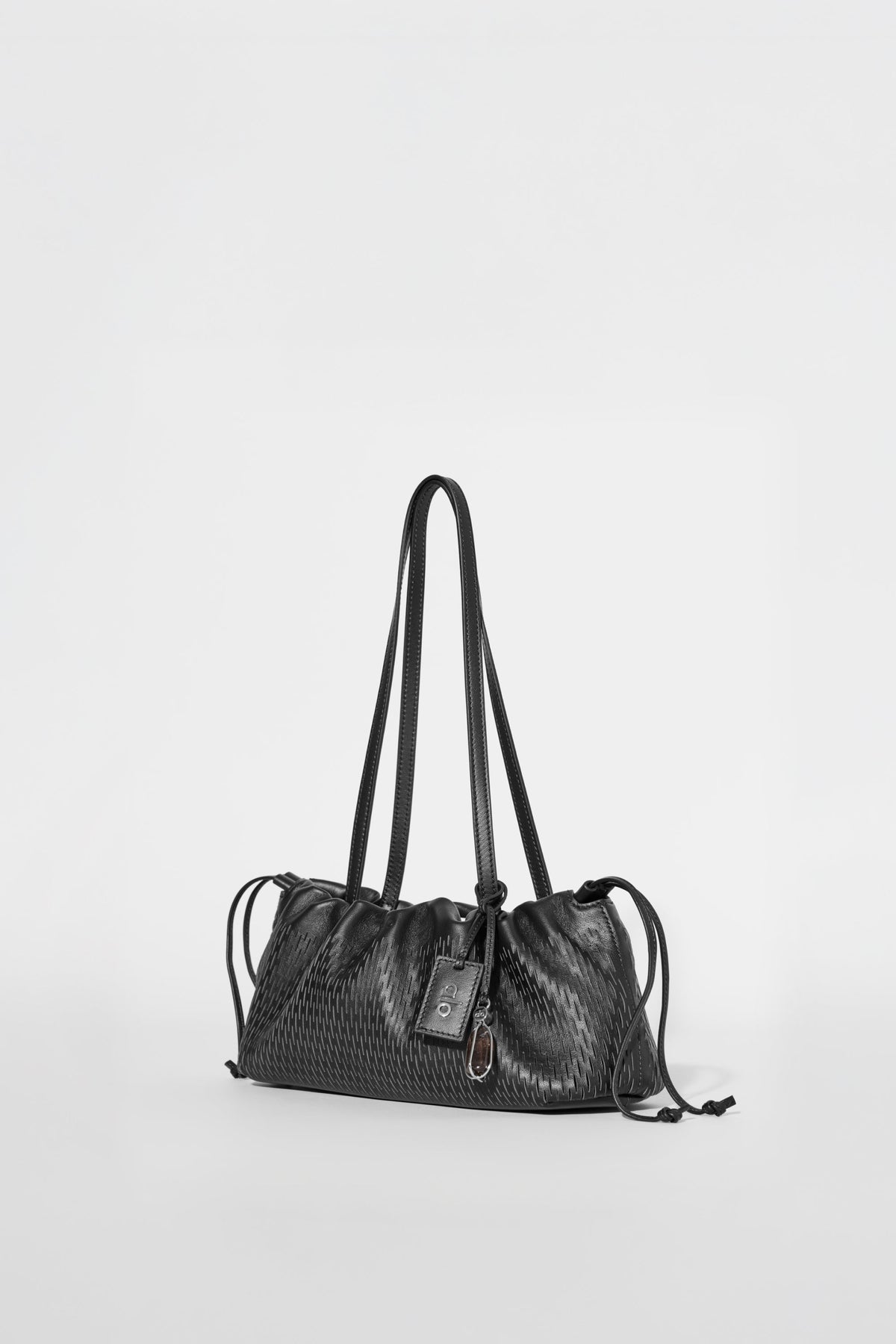 Mini-sac à cordon ALO Unwind en cuir ajouré - Cuir ajouré noir