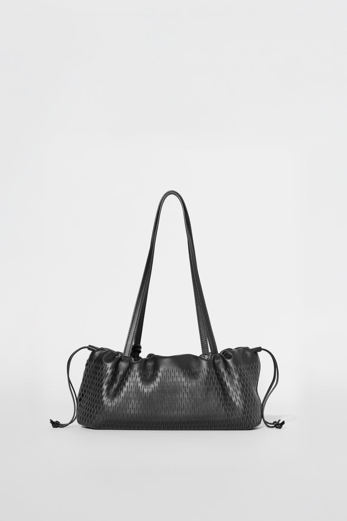 Mini-sac à cordon ALO Unwind en cuir ajouré - Cuir ajouré noir